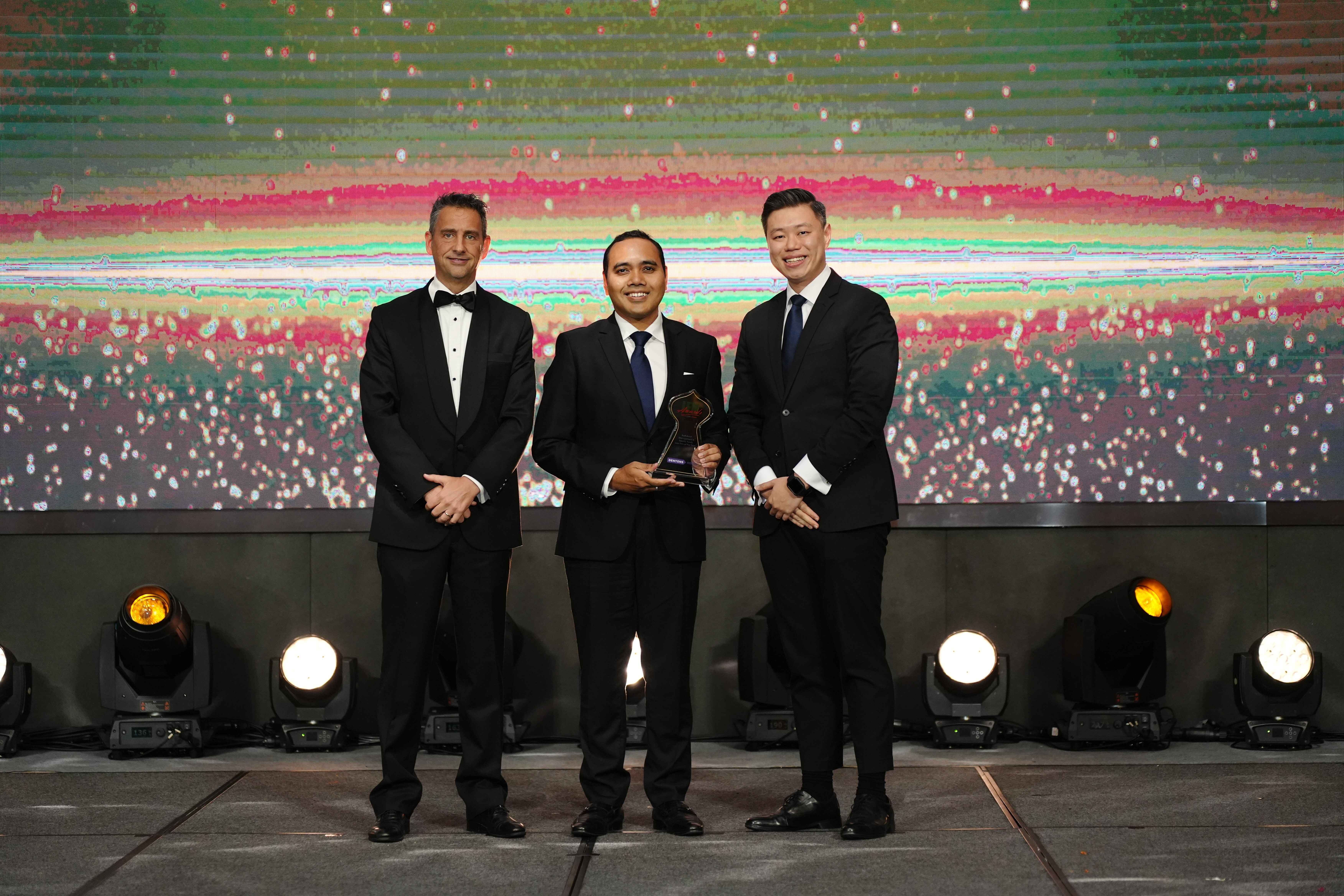 Senior Partner Zhulkarnain Abdul Rahim (centre) and Senior Associate Manfred Lum (right) receive the Asset Management and Islamic Funds Law Firm of the Year award on behalf of the firm
